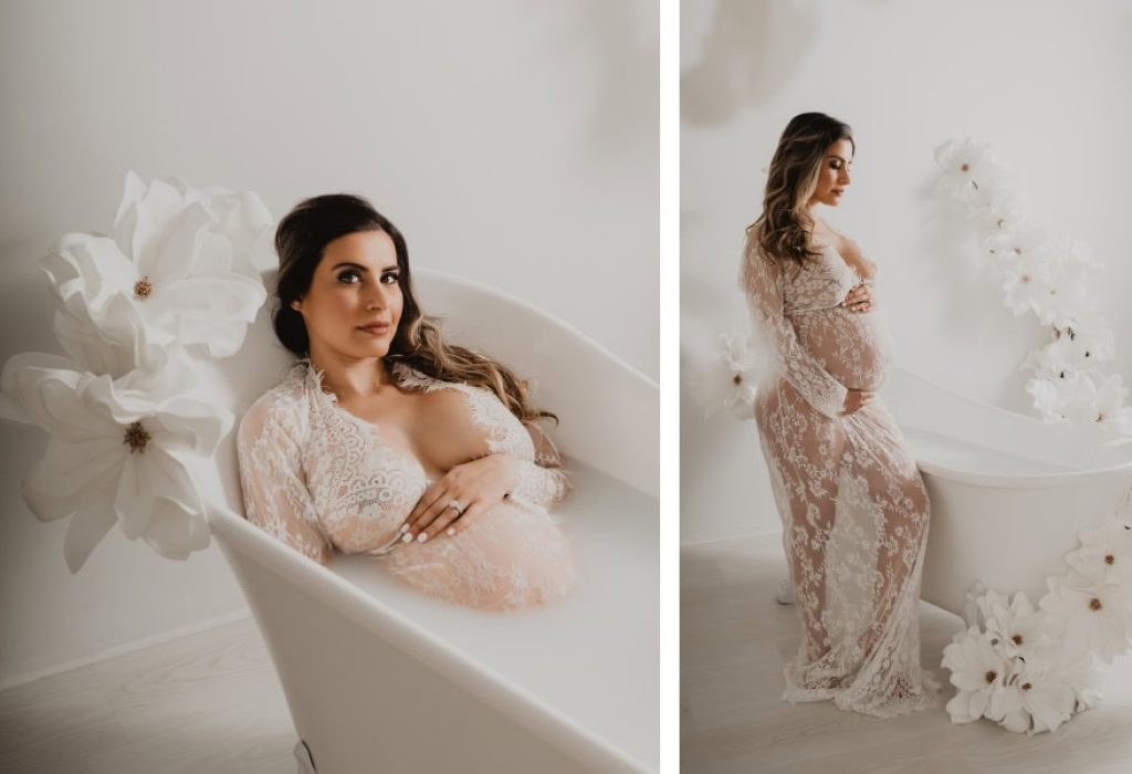 Studio maternity portrait of smiling pregnant woman in a lace robe with white floral tub, photographed in Manchester NH