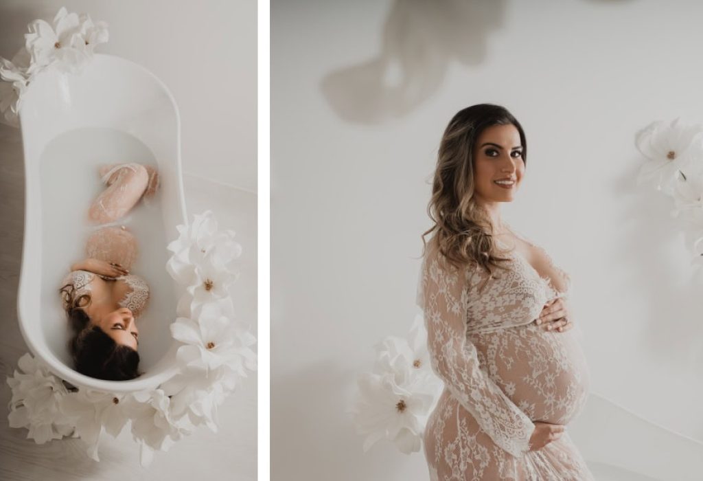 Top view of maternity milk bath with large artificial flowers and expecting mother in lace gown, captured by NH maternity photographer